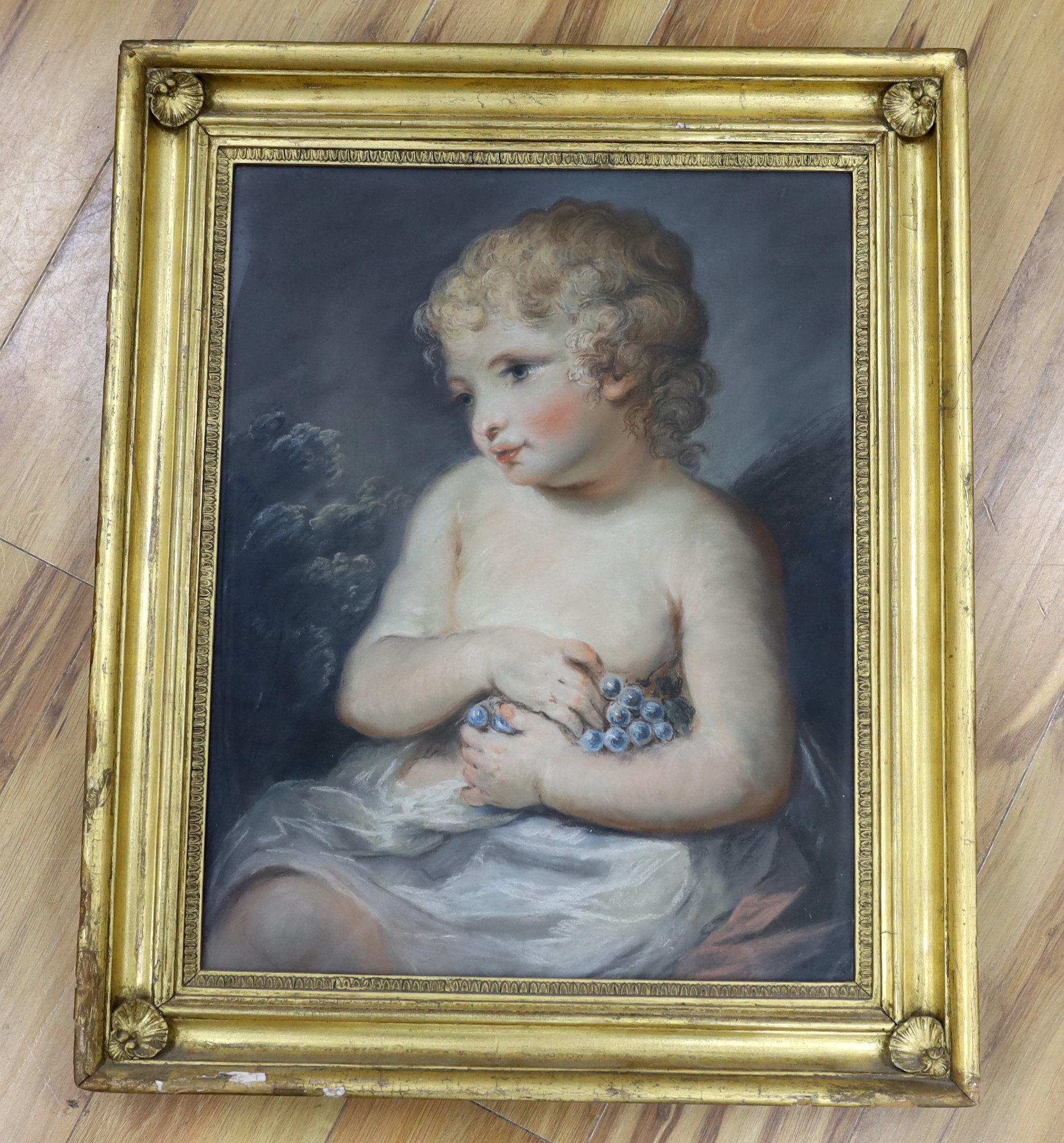 Manner of Joshua Reynolds (1723-1792), 19th century pastel, Portrait of a child holding grapes, ornate gilt frame, 57 x 44cm
